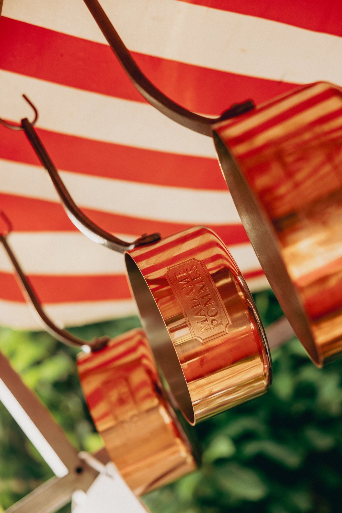 The row of copper pans